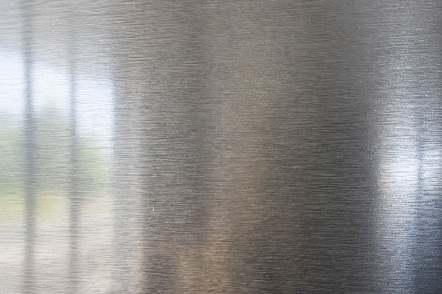Brushed stainless steel panel of a built-in Sub-Zero refrigerator in a Dublin Ranch kitchen